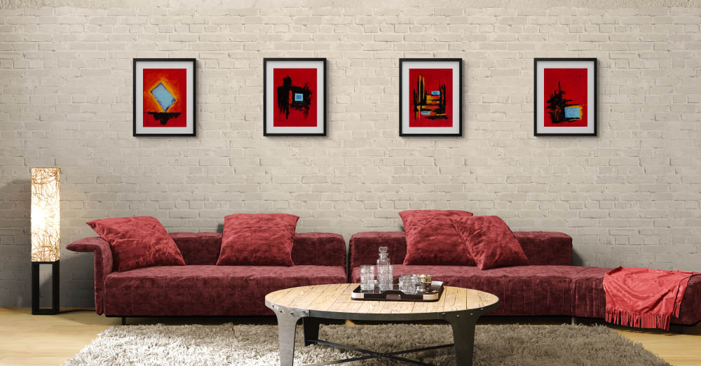 tableau abstrait rouge au-dessus d’un canapé dans un salon contemporain